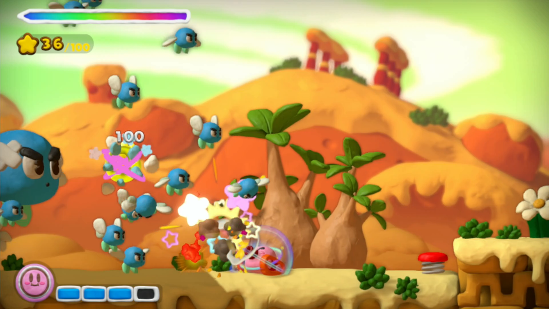 Kirby in tank mode, fighting off loads of enemies