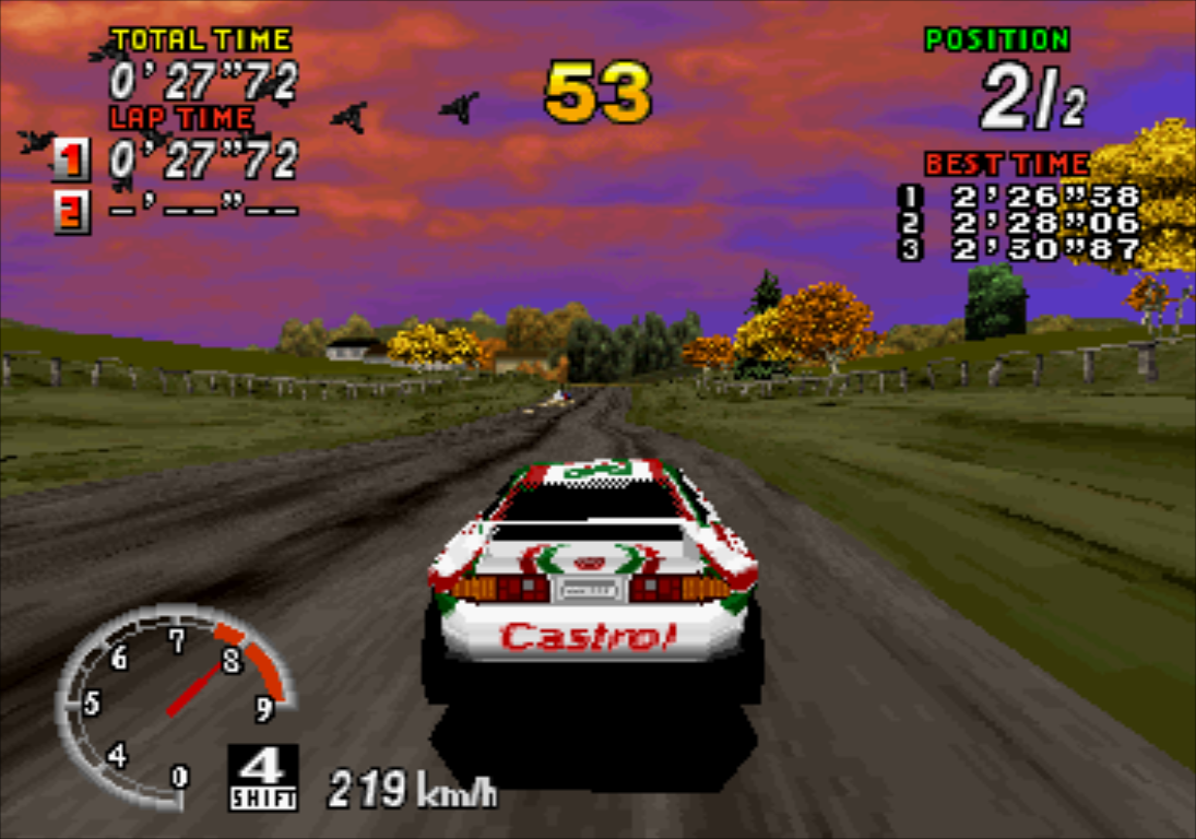 SEGA Rally Championship Saturn Celica drives the Lakeside course with a flock of birds passing